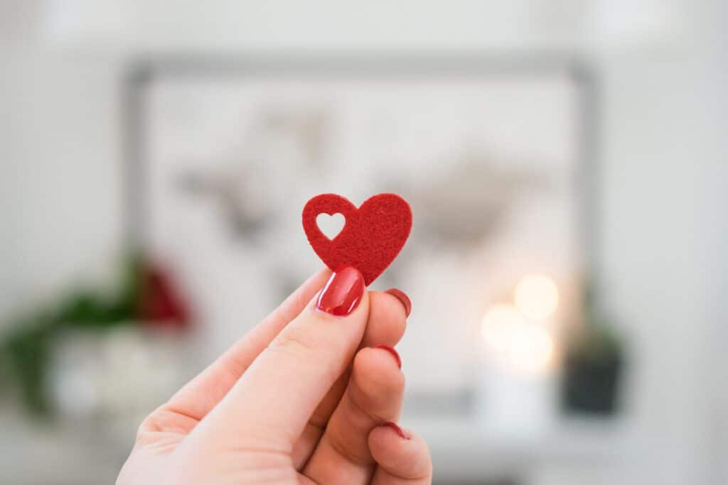 hand holding a paper heart