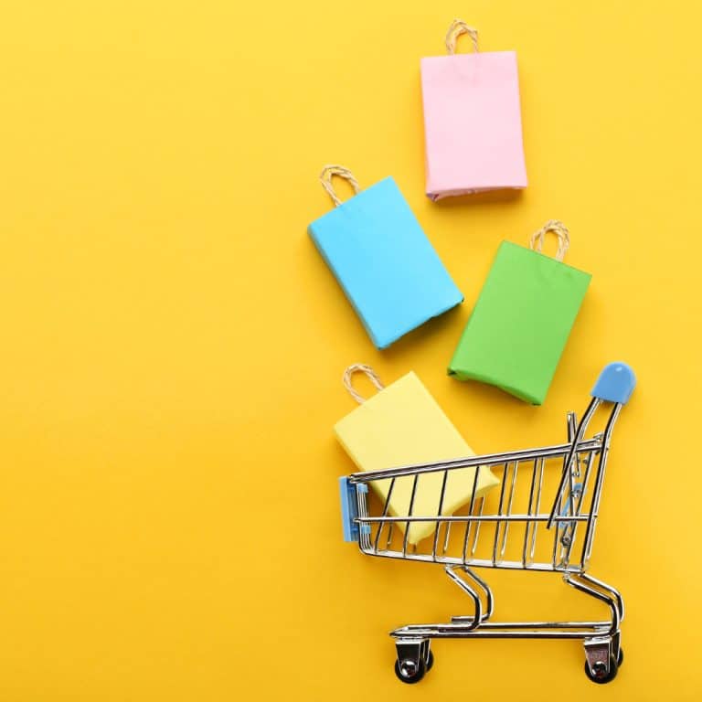 A picture of a small shopping cart tab with small shopping bags. This represents shopping small to support small businesses.